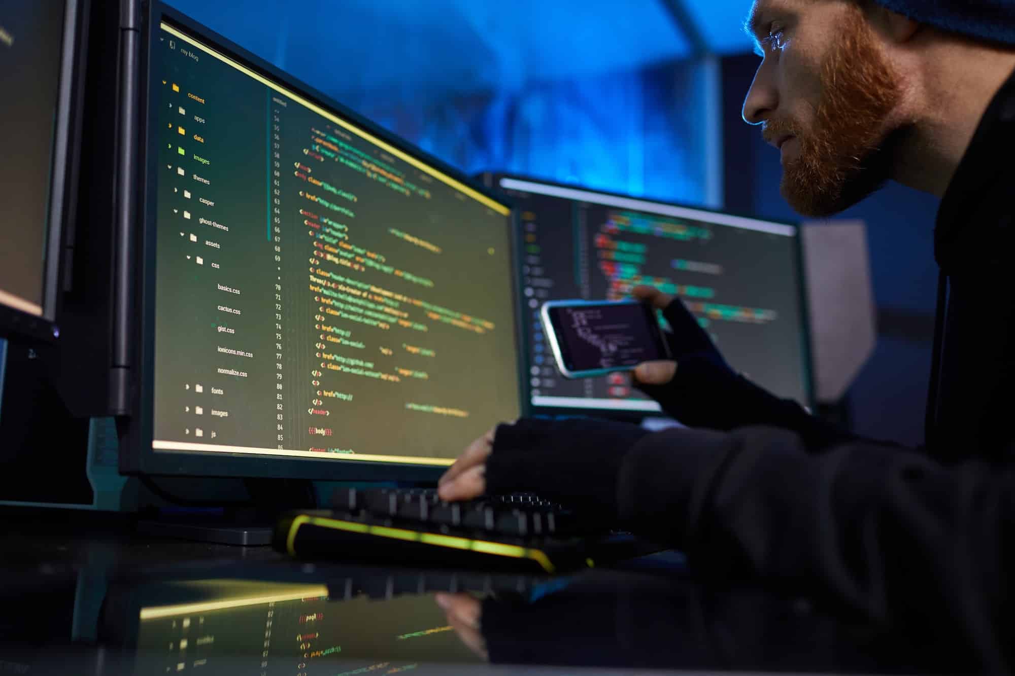 Hacker breaking the system on computers