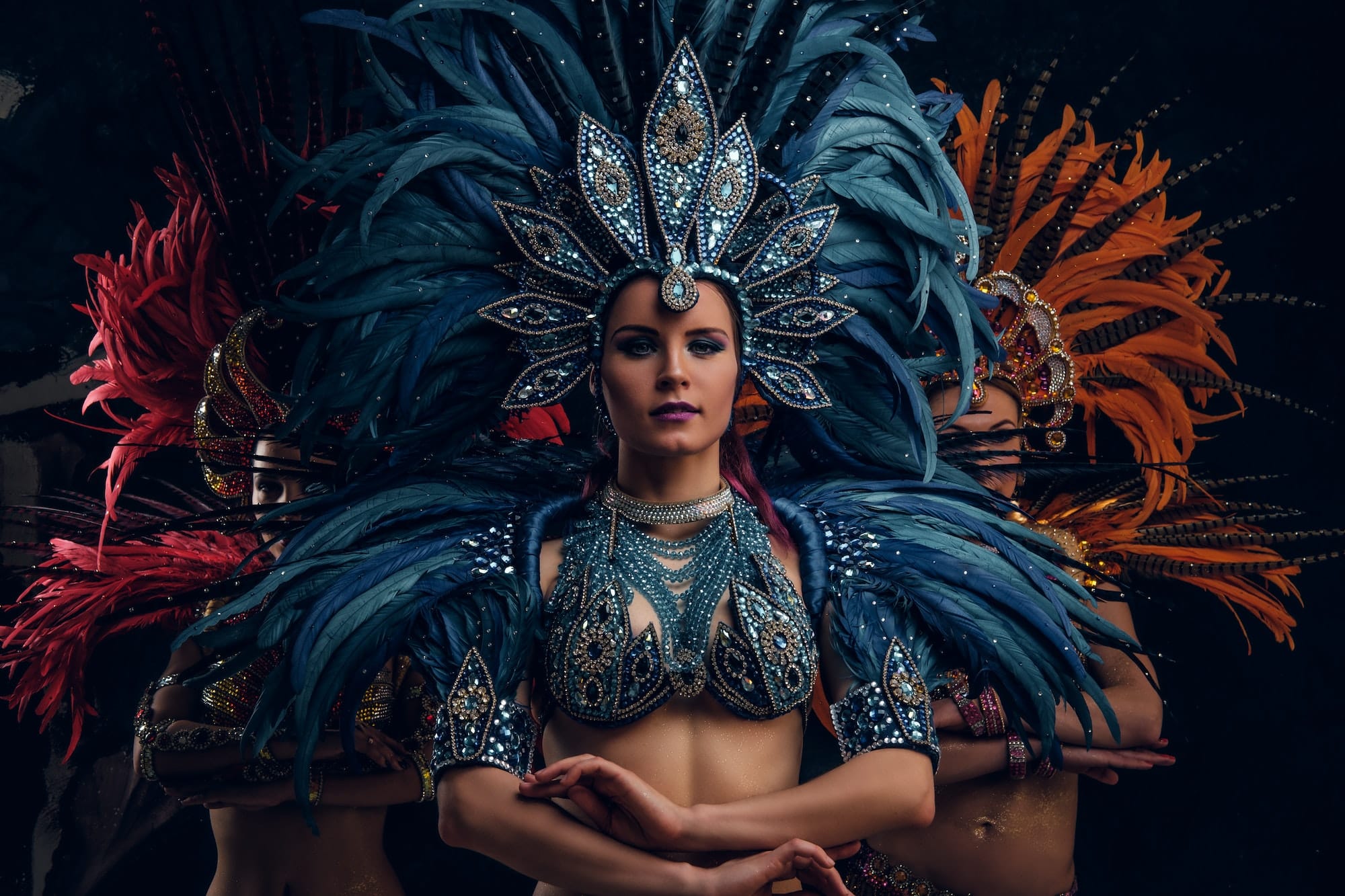 Three beautiful women in traditional brazilian carnival costumes