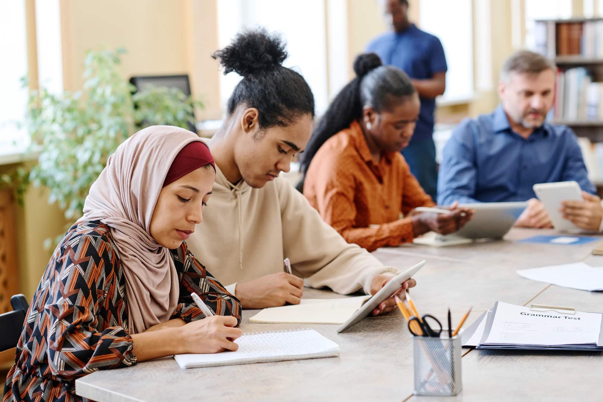Migrant Students Doing Writing Task