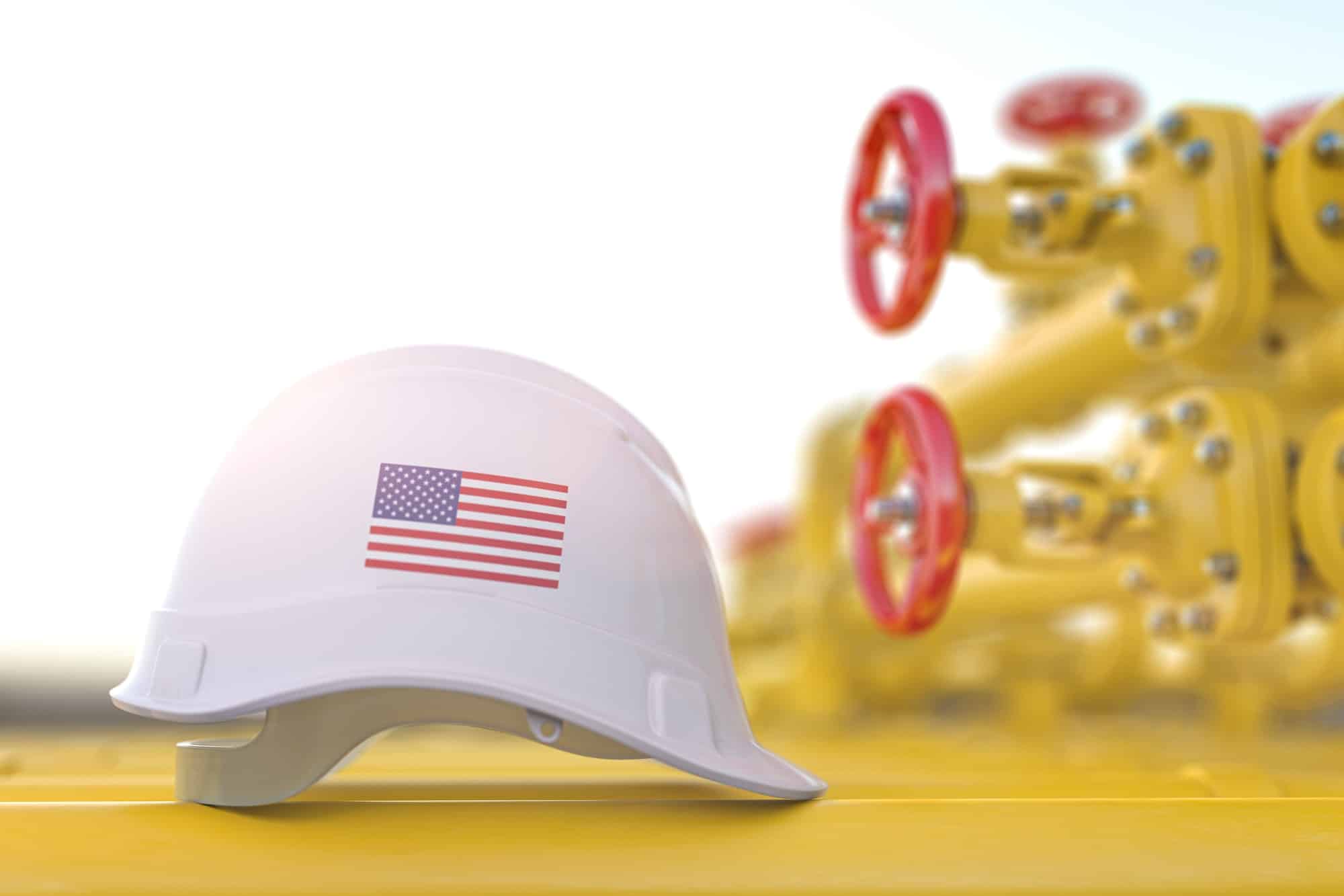 Oil and gas industrial of USA. United States flag on a hard hat with gas valve tubes.