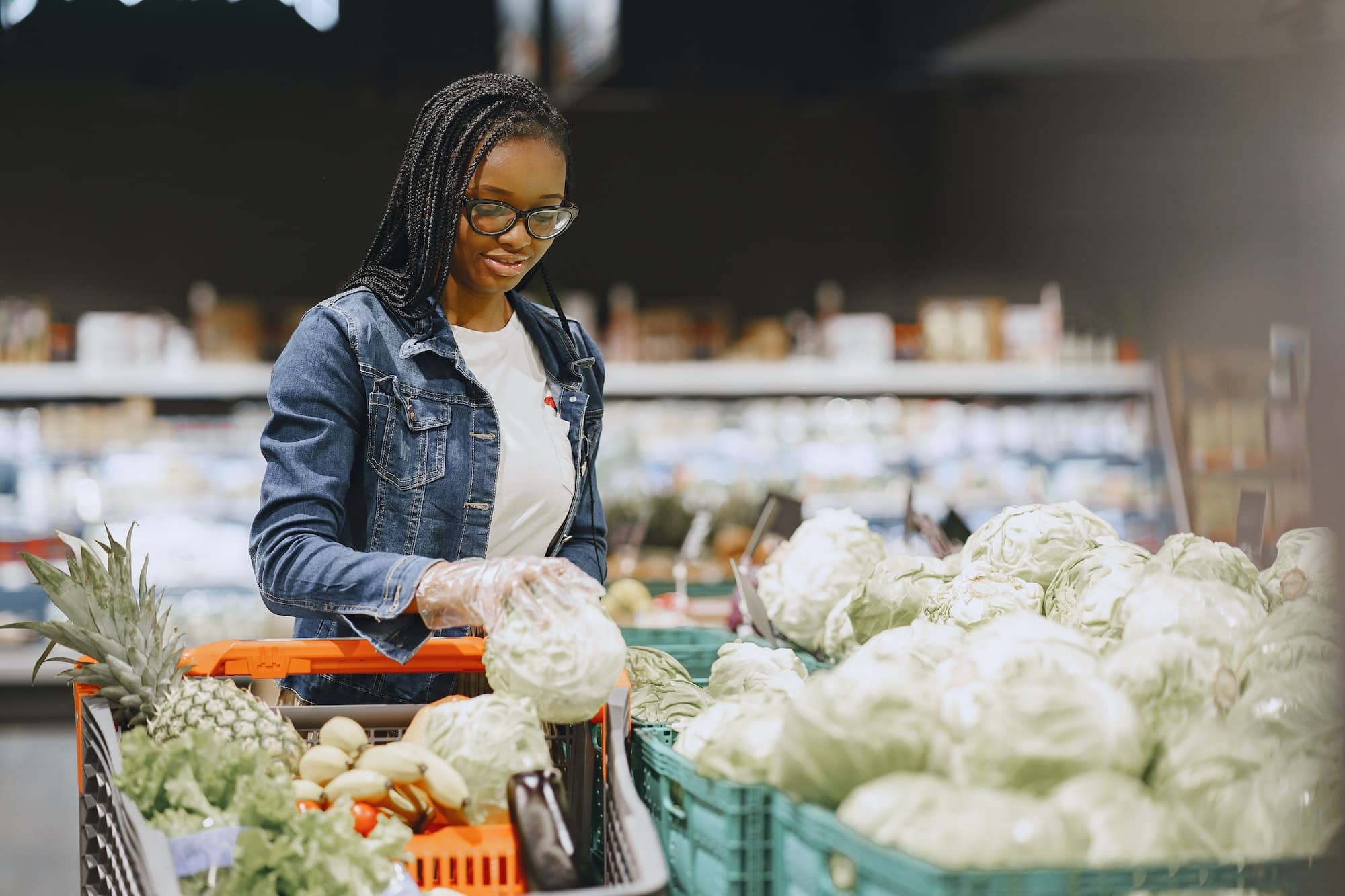 Woman shopping vegetables at the supermarket
