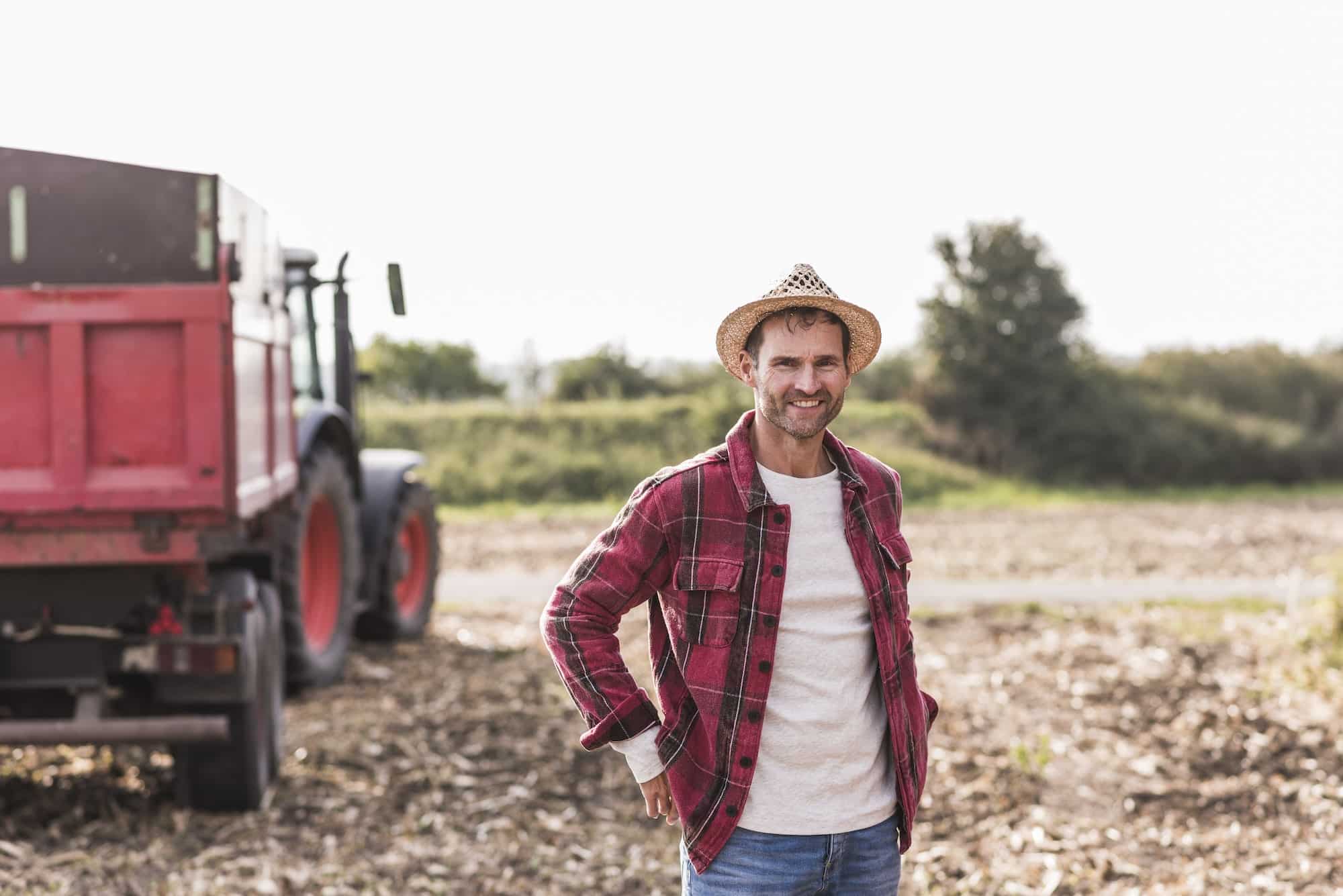 Portrait of confident farmer on field