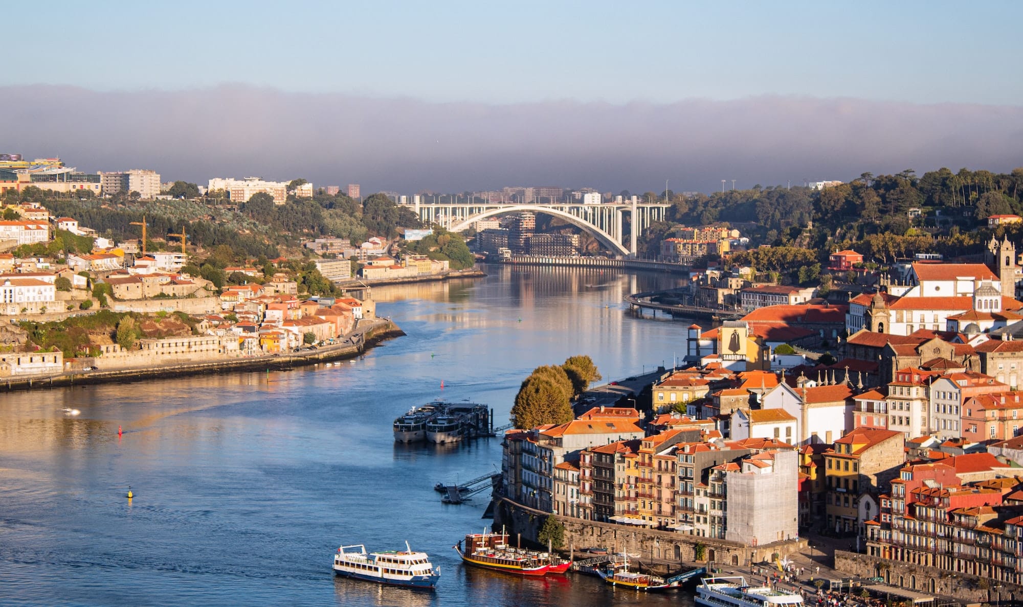 Aerial view of the Ponte Dona Maria Pia bridge connects the coasts of Vila Nova de Gaia