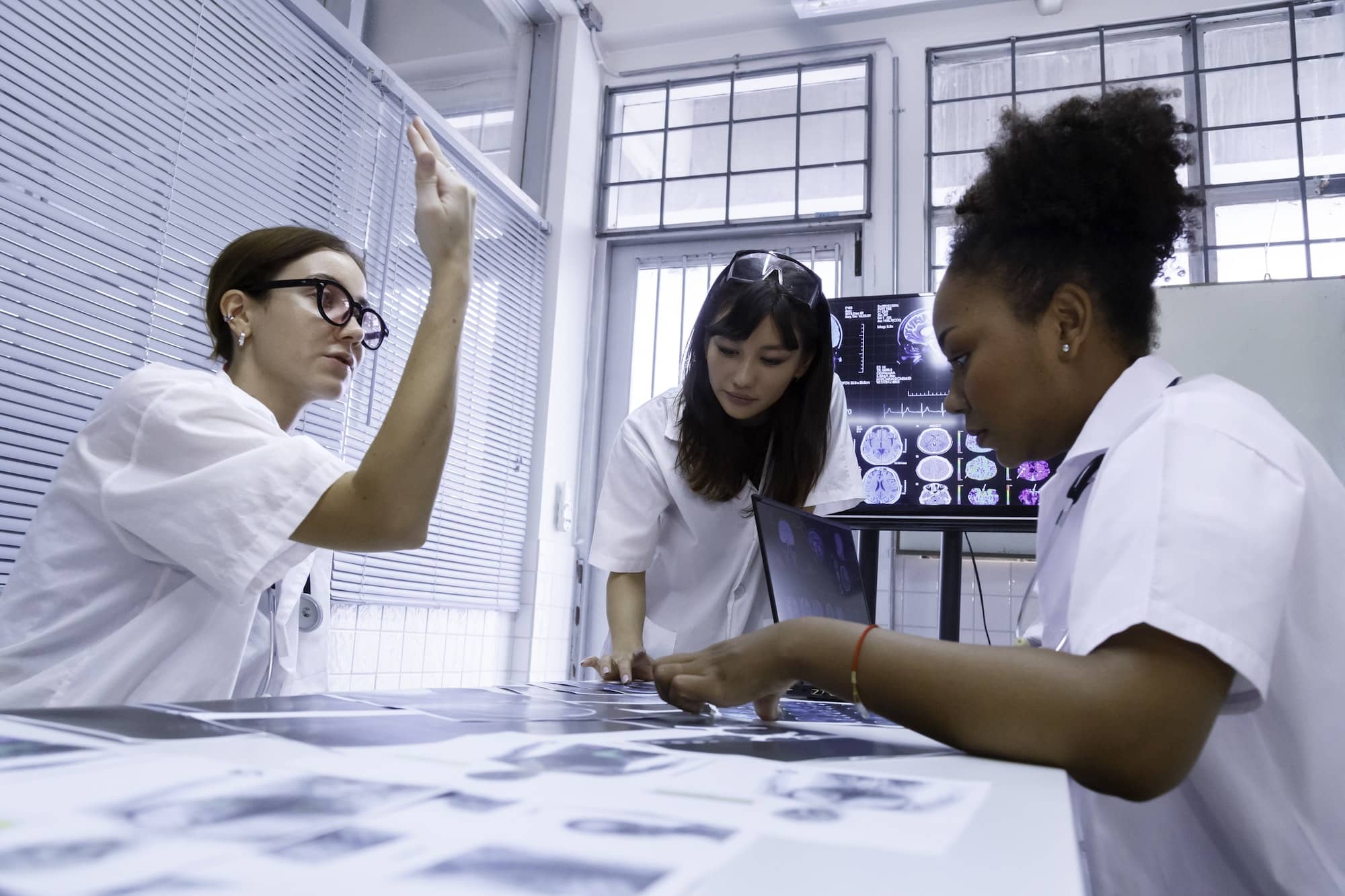 young female doctor students internship meeting to discus in brain cancer surgery at lab in hospital