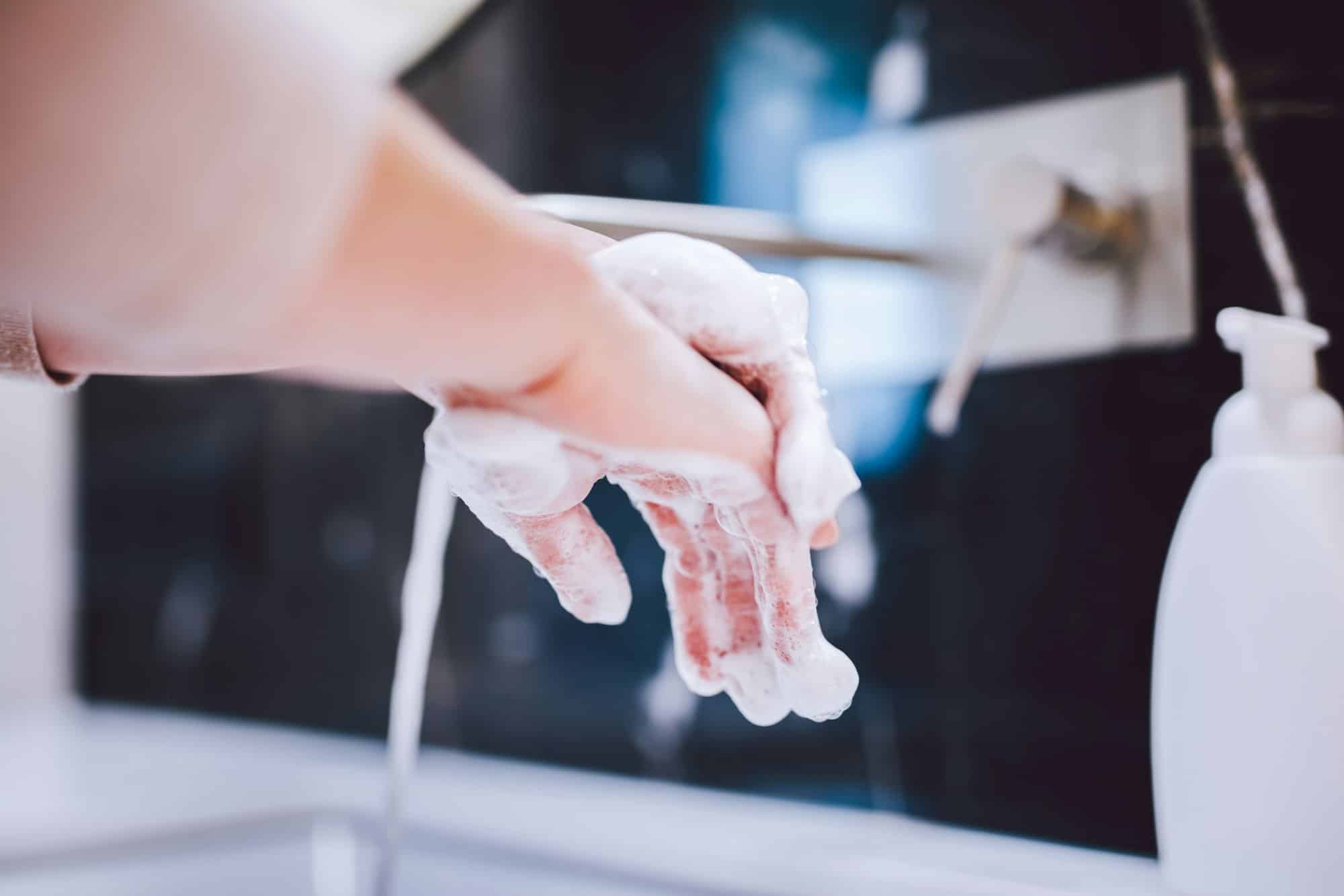 Washing hands with foam soap. Hygiene, preventing coronavirus
