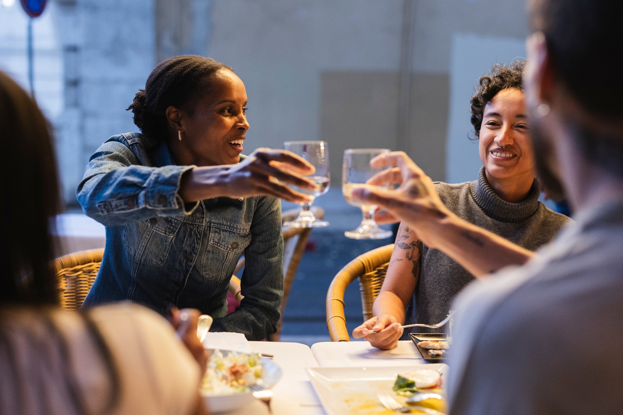 Friends toasting during dinner in lisbon restaurant