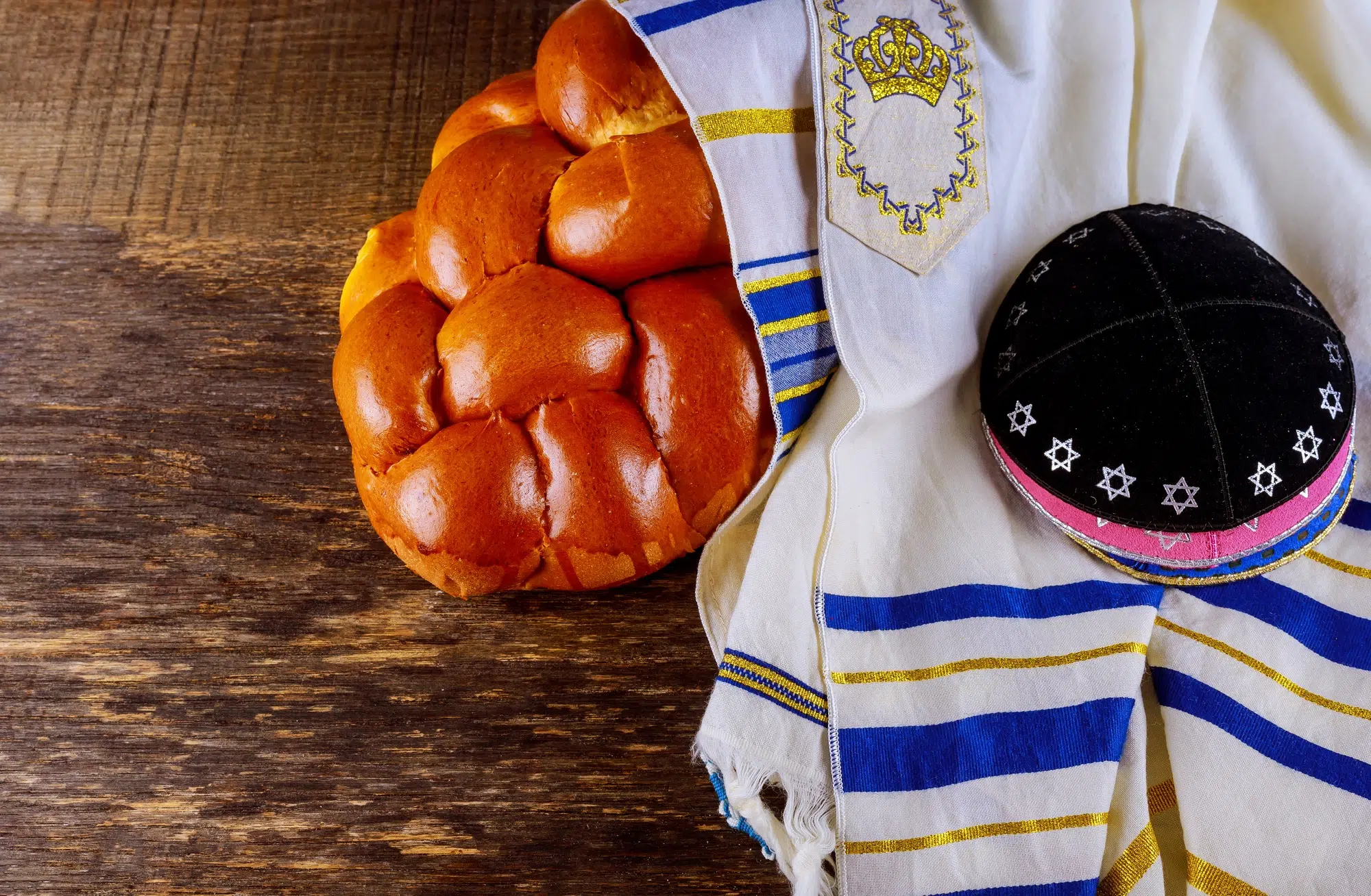 Shabbat Jewish holiday with challah bread on a wooden table