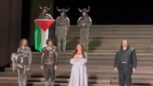 Opera interpreter in London appears on stage with Palestinian flag