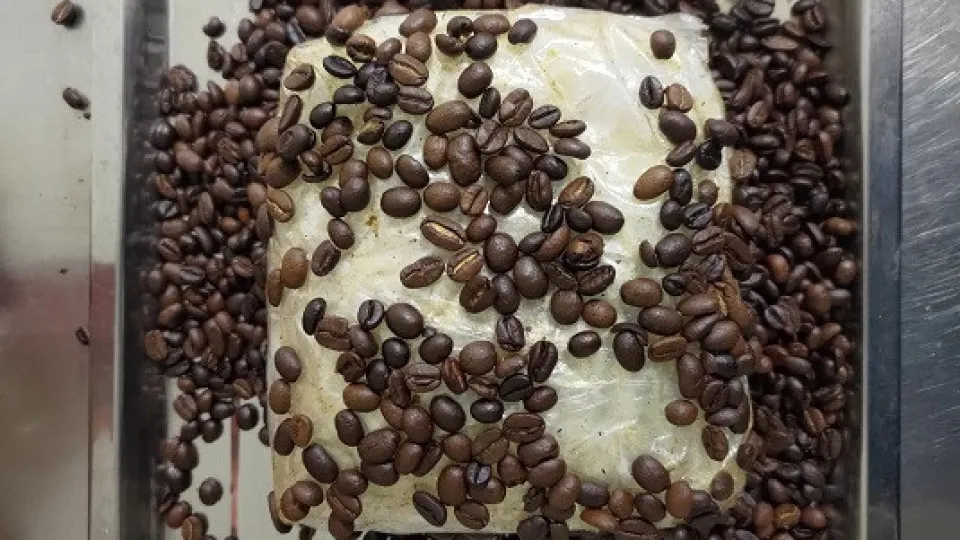 Travels to Lisbon with drugs hidden in coffee packages. Ended up arrested.